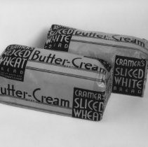Two loafs of Cramer's Butter - Cream white and wheat bread.