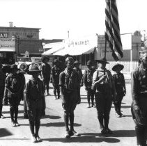 El Centro Boy Scout Troop No. 7 marching in a parade on Main St.