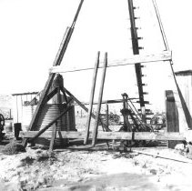 Water well used for paving highway through sand dunes.