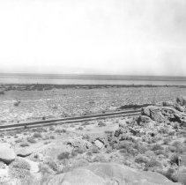 Overview of the Salton sea showing Highway 86 and Travertine Rock in foregr