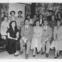Carrot Carnival - Contestants for Miss Imperial Valley seated with two men.