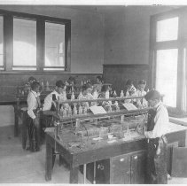 Central High School. Interior of science classroom showing students at lab