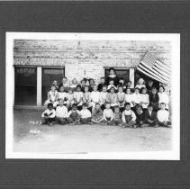 Teacher, Tillie Borden Wilsie standing with her students
