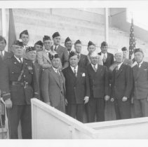 Group of men wearing their American Legions hats.