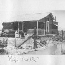Mabel Clare Edgar aka Mrs. Ray Edgar in front of her desert home in Calexic