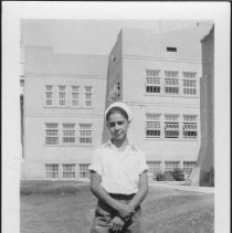 Victor Hetzel standing in front of Central High School.