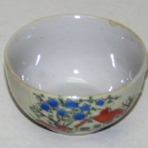 Tea cup to a child's tea set.