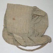 Baby bonnet that belonged to Lowell O. Weeks, of Holtville.