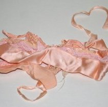 Bra / brassier. pink with lace inserts.