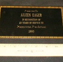 Brass plaque that reads: Presented to Aileen F. Eager,