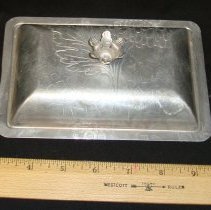 Aluminum lid to cover butter.