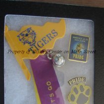 Three pins commemorating Tiger mascot and Tiger Pride.