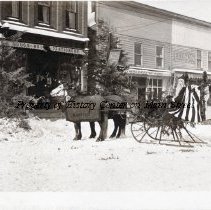 Christmas 1914. Santa Claus (Mr. Ballard) in front of Bates Drug Store