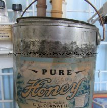 Two Honey Cans with Elmer G. Cornwall Label.
