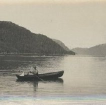 Bob rowing small boat