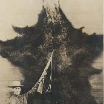 Dr. Chase with large bear hide