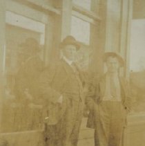 two men in front of store