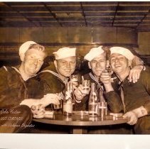 Colie Yeater and sailors at a bar
