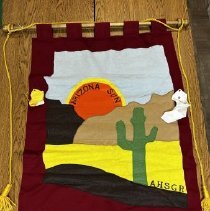 Dark red banner with a cut-out of Arizona. The cut-out of Arizona has light