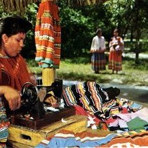 Seminole woman sewing garments