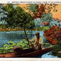 Seminole Indian hunter in dug out canoe