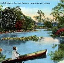Seminole Indian in dug out canoe