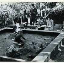 Franklin high school.  Nursery school activities.  High school students observing nursery children playing in a sandbox.