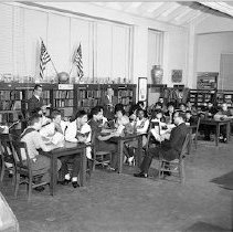 Gifted children participate in various activities at Berendo Jr. High School.  Members of the "Great Book Club", Reading.