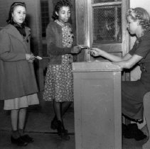 Jordan high school activities.  Girl collecting hall passes.
