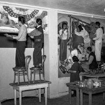 Jordan high school activities.  Students painting mural on school walls.