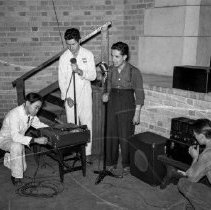Jordan high school activities.  Students setting up sound equipment in auditorium.