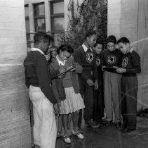 Jordan high school activities.  Checking in students from the street.