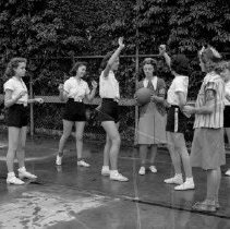 Virgil junior high school activities.  Club leaders supervise girls’ basketball game.