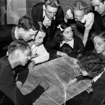 Washington high school activities.  Discussion group [reading a map of the 