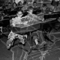 Washington Boulevard Center School Activities.  Boy and girl enjoying their story books.