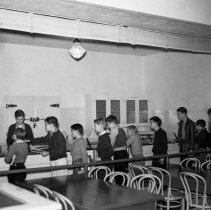 Bancroft junior high school activities.  Nutrition group getting milk in the cafeteria.