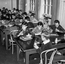 Bancroft junior high school activities.  Nutrition group drinking milk in the cafeteria.