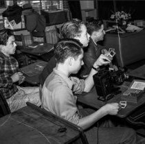 Bancroft junior high school activities.  Students using S.V.E. [Society for Visual Education] projector in classroom.