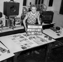 Bancroft junior high school activities.  Boy demonstrating lantern slides.