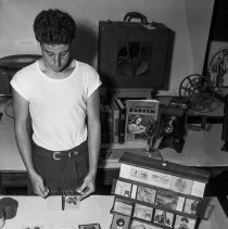 Bancroft junior high school activities.  Boy demonstrating hinge glass.