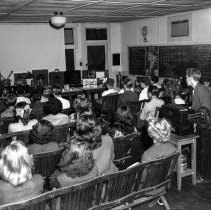 Bancroft junior high school activities.  Students working with and operating audio-visual tools.  Class looking at student operated motion picture.