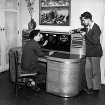 Bancroft junior high school activities.  Students working with and operating audio-visual tools.  Students operating loud speaker system.