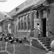 109th Street school.  Exterior.  Entrances to classrooms of new unit.