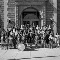 Sterry school activities.  Orchestra grouped in front of school entrance.