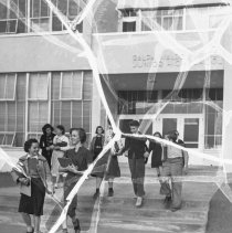 Emerson junior high school.  Exterior.  Students leaving through the main entrance.