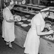 Bancroft junior high school activities.  Cafeteria.  Frosting cakes.
