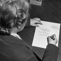 Consumer interest committee of the Los Angeles city defense council at North Hollywood high school.  Committee member writing to her senator.