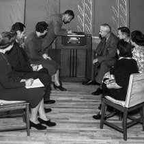 Consumer interest committee of the Los Angeles city defense council at North Hollywood high school.  Study club listening to radio program.