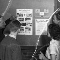 Polytechnic high.  Examining playground safety patrol suggestion card.