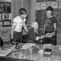 Los Angeles City High School students marketing sheep at the Los Angeles Union stockyards. Boys being presented with checks for their prize winning sheep.   [Future Farmer’s of America (FFA), Agriculture]